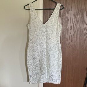 White lace, sparkle cocktail length dress. Deep V cut.
